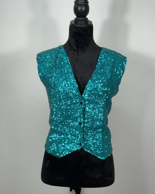 Sequin vests:  Touq.