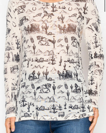 Person wearing a long-sleeve shirt with a desert-themed pattern on a white background