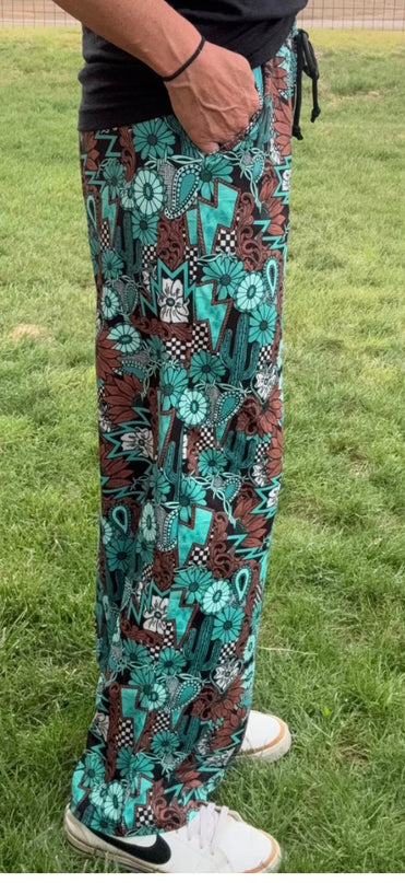 SK Tattoos in Turquoise Pants
